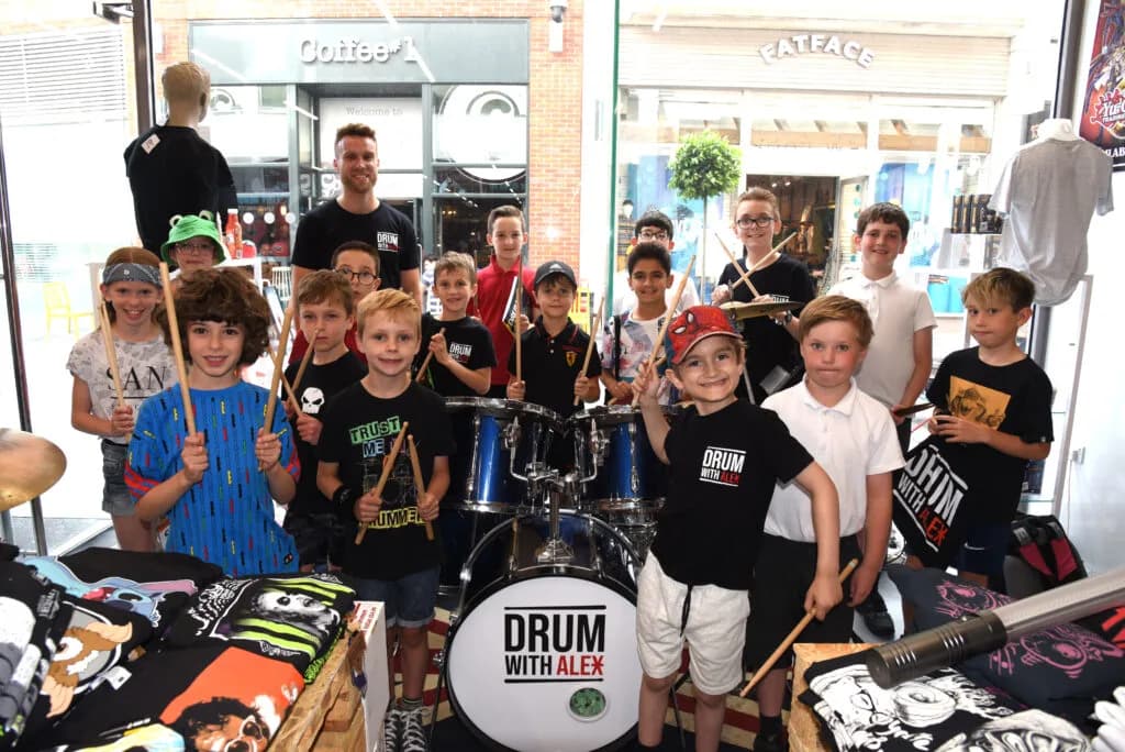 Drum With Alex student showcase at HMV in Newbury with students performing