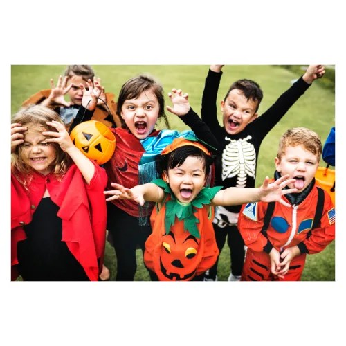 Children celebrating Halloween in colourful costumes.